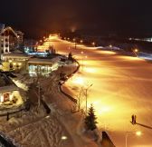 KEMPINSKI HOTEL GRAND ARENA BANSKO - Winter facade and ski road in night